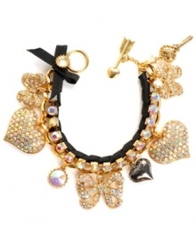 Get all gussied up! Betsey Johnson's glam toggle bracelet combines pave-set crystal hearts and ribbons intertwined with a black grosgrain ribbon. Crafted in gold tone mixed metal. Approximate length: 7-1/2 inches.