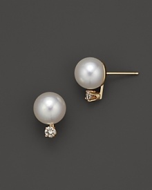 Diamonds and pearls, set in elegant 14K. yellow gold.