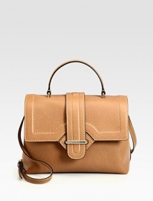 The ultimate chic top-handle design, impeccably-crafted of pebbled calfskin leather. Top handle, 4 dropAdjustable shoulder strap, 20¾-22¾ dropPush-lock closure on front flapProtective metal feetOne inner zip compartmentOne inside zip pocketFully lined11¾W X 9H X 5½DMade in Italy The ultimate chic top-handle design, impeccably-crafted of pebbled calfskin leather. Top handle, 4 dropAdjustable shoulder strap, 20¾-22¾ dropPush-lock closure on front flapProtective metal feetOne inner zip compartmentOne inside zip pocketFully lined11¾W X 9H X 5½DMade in Italy