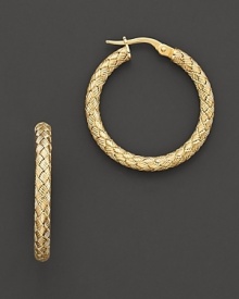 Large woven gold hoop earrings; with signature ruby accent. Post back for pierced ears. Designed by Roberto Coin.