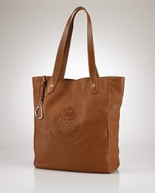 Crafted for chic versatility in sumptuous pebbled leather, the Putnum tote is finished with equestrian-inspired accents and an elegantly embossed crown crest for an iconic heritage look. From Lauren by Ralph Lauren. Crafted for chic versatility in sumptuous pebbled leather, the Putnum tote is finished with equestrian-inspired accents and an elegantly embossed crown crest for an iconic heritage look. From Lauren by Ralph Lauren.