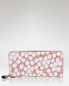 Compact style goes bold with this printed wallet from DIANE von FURSTENBERG. In the brand's signature graphics, this practical piece is almost too pretty to hide inside your purse.