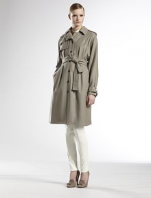 Italian wool, finished with classic trench tailoring.Foldover collarEpaulettesGunflapButton frontRaglan sleevesSelf beltSide slash pocketsBelted button cuffsRainflap92% wool/6% polyester/2% elastaneDry cleanMade in ItalyModel shown is 5'11 (180cm) wearing US size 4. Italian wool, finished with classic trench tailoring.Foldover collarEpaulettesGunflapButton frontRaglan sleevesSelf beltSide slash pocketsBelted button cuffsRainflap92% wool/6% polyester/2% elastaneDry cleanMade in ItalyModel shown is 5'11 (180cm) wearing US size 4.