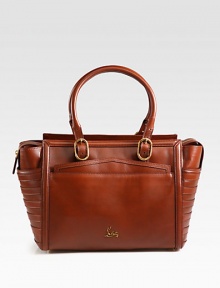 A sophisticated leather style that reveals the brand's artistry with beautiful topstitched details and well crafted accents.Double adjustable shoulder straps, 7-11 dropTop zip closureFour outside open pocketsOne inside zip pocketTwo inside open pocketsSignature red lining12W X 11H X 6½DImported A sophisticated leather style that reveals the brand's artistry with beautiful topstitched details and well crafted accents.Double adjustable shoulder straps, 7-11 dropTop zip closureFour outside open pocketsOne inside zip pocketTwo inside open pocketsSignature red lining12W X 11H X 6½DImported
