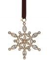 Create a winter wonderland like no other with the Ice Queen Snowflake ornament from kate spade new york. Dazzling crystal gems set in gold plate lend unparalleled shine to the season. With spade charm.