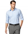 Handsome dress shirt with rich vertical stripes by Van Heusen.