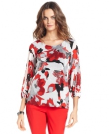 Alfani elevates this top with an abstract floral print and patches of embroidery and sequins.