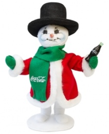 A thirsty snowman pops open a different type of holiday bubbly in this essential figurine for Coca-Cola collectors. Crafted with the soft, flexible features and unmistakable style of Annalee.