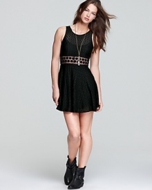 Girlish with an edge, this Free People mini dress flaunts a skin-baring crochet waistband.