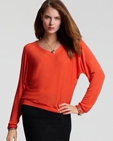 Vibrantly punctuate your fall wardrobe with this eye-popping Kain Label sweater.