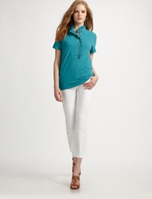 A classic design with a feminine twist thanks to a pretty ruffle stand collar.Ruffle stand collarRuffle-enhanced button placketSignature buttonsShort sleevesPull-on styleAbout 24 from shoulder to hem49% pima cotton/49% modal/2% Lycra®Machine washImported Model shown is 5'10 (177cm) wearing US size Small. A classic design with a feminine twist thanks to a pretty ruffle stand collar.Ruffle stand collarRuffle-enhanced button placketSignature buttonsShort sleevesPull-on styleAbout 24 from shoulder to hem49% pima cotton/49% modal/2% Lycra®Machine washImported Model shown is 5'10 (177cm) wearing US size Small.