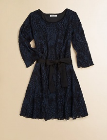 A beautiful crochet lace frock with sash tie and full skirt for a romantic touch.Scalloped scoopneckThree-quarter sleevesPullover styleAdjustable waistband with sashFull skirt55% cotton/45% nylonDry cleanMade in the USA of imported fabric A beautiful crochet lace frock with sash tie and full skirt for a romantic touch.Scalloped scoopneckThree-quarter sleevesPullover styleAdjustable waistband with sashFull skirt55% cotton/45% nylonDry cleanMade in the USA of imported fabric