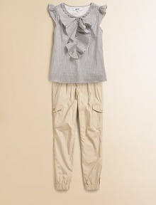 This cotton woven twill has a feminine appeal with ruffle front detailing and fluttering sleeves. Crewneck with ruffle trimPullover style with front button closureShort cap sleeves with ruffle edgesCottonMachine washImported This cotton woven twill has a feminine appeal with ruffle front detailing and fluttering sleeves. Crewneck with ruffle trimPullover style with front button closureShort cap sleeves with ruffle edgesCottonMachine washImported