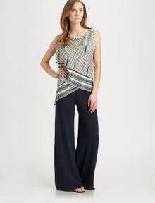A unique top with fashion-forward details like asymmetrical sleeves and a sarong-inspired bodice.Draped neckAsymmetrical sleeves and hemSarong-style silhouetteAbout 25 from shoulder to hemCottonDry cleanMade in Italy Model shown is 5'9 (175cm) wearing US size Small. A unique top with fashion-forward details like asymmetrical sleeves and a sarong-inspired bodice.Draped neckAsymmetrical sleeves and hemSarong-style silhouetteAbout 25 from shoulder to hemCottonDry cleanMade in Italy Model shown is 5'9 (175cm) wearing US size Small.