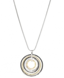 Round and resplendent. This necklace from Nine West is crafted from silver-tone mixed metal, with a pendant made of the same-plus gold-tone and hematite-tone mixed metal-for a stunning effect. Approximate length: 16 inches + 2-inch extender. Approximate drop: 2 inches. Approximate diameter: 1-7/8 inches.