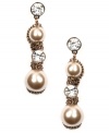 Put on the finishing touches. Givenchy's special occasion earrings shimmer with the addition of glass pearls and crystals. Set in unique brown gold-plated mixed metal. Approximate drop: 2-1/4 inches.