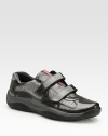 Bold patent leather and mesh detail make a sporty statement. Leather lining Padded insole Rubber sole Imported 