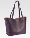 The popular, python-embossed leather tote features full interior pocket and a magnetic closure. Its lightweight feel, generous interior, and luxuriously soft handle make it equally chic and practical.17W X 11H X 6DPython-embossed leatherMade in USAFOR PERSONALIZATIONSelect a color and quantity, then scroll down and click on PERSONALIZE & ADD TO BAG to choose and preview your monogramming options. Please allow 1 week for delivery.