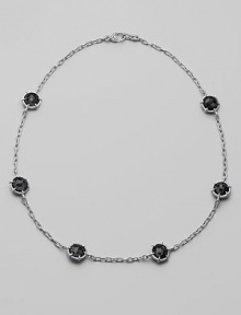 Six faceted discs of black onyx, dramatically stationed along a textured sterling silver chain. Black onyx Sterling silver Length, about 17 Heart-shaped lobster clasp Made in USA Six faceted discs of black onyx, dramatically stationed along a textured sterling silver chain. Black onyx Sterling silver Length, about 17 Heart-shaped lobster clasp Made in USA