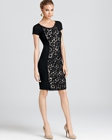 Lace brings a touch of drama to this sophisticated Moschino Cheap and Chic short sleeve dress in plush wool.