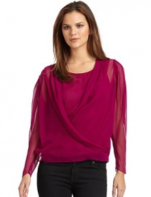 THE LOOKDeep V necklinePleated shouldersCrossover frontPleated long sleevesRemovable scoopneck tank topTHE FITAbout 23 from shoulder to hemTHE MATERIALSilkCARE & ORIGINDry cleanImported