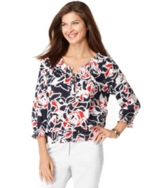 A graphic floral print adorns this bold peasant top from Jones New York Signature. Pair it with white trousers for a crisp ensemble.