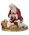 A glowing Santa Claus with rosy red cheeks kneels beside Baby Jesus in this figurine that you'll cherish for years to come.