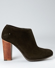 A wooden heel lends a natural contrast to soft suede, sure to appeal to design and fashion connoisseurs alike. A wooden heel lends a natural contrast to soft suede, sure to appeal to design and fashion connoisseurs alike.