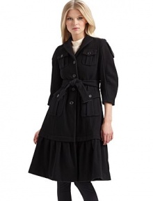 Military styling fused with ladylike influences for a luxurious wool overcoat that commands attention.Notched collar ¾ puffed sleeves with button tabs Front button closure Front button flap pockets Buckled belt ties at the waist Long ruffled hem About 40 from shoulder to hem Fully lined Wool; dry clean Made in Italy Military styling fused with ladylike influences for a luxurious wool overcoat that commands attention.Notched collar ¾ puffed sleeves with button tabs Front button closure Front button flap pockets Buckled belt ties at the waist Long ruffled hem About 40 from shoulder to hem Fully lined Wool; dry clean Made in Italy