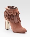 On-trend suede fringe emboldened by a partially metal heel and dainty, wrap-around buckle. Suede and metal heel, 4½ (115mm) Suede upper Side zipper Leather lining and sole Padded insole Made in ItalyOUR FIT MODEL RECOMMENDS ordering one half size up as this style runs small. 