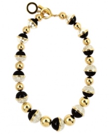 A trio of elegance, from Anne Klein. This statement necklace grabs attention with sparkling crystals, glossy blacks and golden shine. Finished with a toggle closure. Crafted in gold tone mixed metal. Approximate length: 16 inches + 1-inch extender.