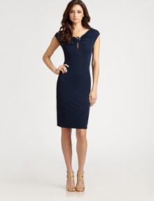 An alluring, twist-keyhole front embellished with a metal ring detail adorns this sleek, pullover design.Twist-front neckline with metal ring detailFront keyholeCap sleevesAbout 26 from waist to hemViscoseDry cleanMade in ItalyModel shown is 5'10 (177cm) wearing US size 4. An alluring, twist-keyhole front embellished with a metal ring detail adorns this sleek, pullover design.Twist-front neckline with metal ring detailFront keyholeCap sleevesAbout 26 from waist to hemViscoseDry cleanMade in ItalyModel shown is 5'10 (177cm) wearing US size 4.
