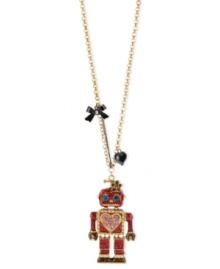 This robot has found love. Betsey Johnson's cute pendant necklace features a long chain displaying a fuchsia glitter robot pendant with blue crystal eyes, pink crystal hearts and gold tone details. A black bow and heart finish off the adorable look. Crafted in antique gold tone mixed metal. Approximate length: 31 inches. Approximate drop: 3 inches.