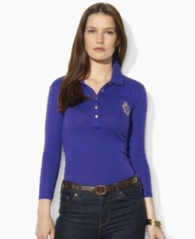 Sleek gold-toned buttons and a metallic embroidered crest lend regal elegance to Lauren Ralph Lauren's soft cotton petite polo shirt.