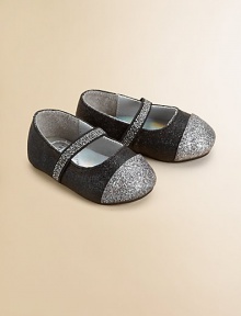 Charming Mary Janes in shimmering glitter fabric, with an easy-on elastic strap and a contrast cap toe.Elastic strapFabric upperFaux leather liningPadded insoleSynthetic suede soleImported Charming Mary Janes in shimmering glitter fabric, with an easy-on elastic strap and a contrast cap toe.Elastic strapFabric upperFaux leather liningPadded insoleSynthetic suede soleImported