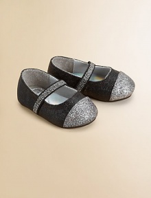 Charming Mary Janes in shimmering glitter fabric, with an easy-on elastic strap and a contrast cap toe.Elastic strapFabric upperFaux leather liningPadded insoleSynthetic suede soleImported