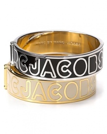 Bold logo lettering adorns this signature bangle from MARC BY MARC JACOBS. Bold logo lettering adorns this signature bangle from MARC BY MARC JACOBS.
