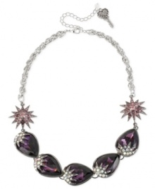 Make a stunning statement with this frontal necklace from Betsey Johnson. Crafted from hematite- and silver-tone mixed metal, the necklace features purple glass crystal accents and gems in teardrop and starburst motifs. Approximate length: 16 inches + 3-inch extender. Approximate drop: 3/4 inch.