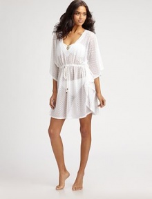 Intricate semi-sheer fabric is crafted into the ultimate cover-up, complete with gold embellished drawstring for an alluring design. Plunging v-neckKimono sleevesDrawstring waist87% polyamide/13% spandexHand washImported Intricate semi-sheer fabric is crafted into the ultimate cover-up, complete with gold embellished drawstring for an alluring design. Plunging v-neckKimono sleevesDrawstring waist87% polyamide/13% spandexHand washImported