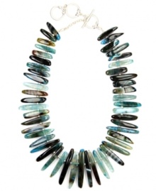 Stylish and serene. Jones New York's tranquil style features elongated blue agate stones that range in color from light blue to dark brown. Silver-plated mixed metal accent beads and toggle clasp add shine. Approximate length: 17 inches + 2-inch extender.