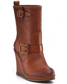 Luxe leather contrasts with structured buckles on these Lucky Brand boots, carrying on the towering wedge trend. Luxe leather contrasts with structured buckles on these Lucky Brand boots, carrying on the towering wedge trend.