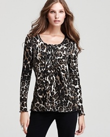 Lined with a seamless lockstitched shapewear tank to slim the figure, this Miraclebody by Miraclesuit top flaunts a chic animal print and shirred detailing for a flirtatious silhouette.