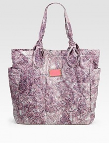 An anything but basic carryall of sleek nylon, featuring a colorful abstract print and signature letter stitching. Double top handles, 9 dropMagnetic snap closureTwo outside open pocketsOne inside zip pocketTwo inside open pocketsFully lined13W X 14¾H X 4½DImported An anything but basic carryall of sleek nylon, featuring a colorful abstract print and signature letter stitching. Double top handles, 9 dropMagnetic snap closureTwo outside open pocketsOne inside zip pocketTwo inside open pocketsFully lined13W X 14¾H X 4½DImported
