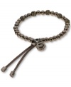 Delicious hues cover the beads on this stretch bracelet from Michael Kors. With a silk cord closure and MK logo charm. Crafted in espresso tone mixed metal. Bracelet stretches to fit wrist. Approximate diameter: 2-1/4 inches.