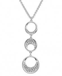 Modern and sophisticated, this pendant offers a beautiful interpretation of a timeless circle motif. Swarovski's fluid design complements a wide variety of outfits. Hanging on a rhodium-plated mixed metal chain, three circular elements are sprinkled with clear crystal pavé for extra sparkle. Approximate length: 15 inches + 2-inch extender. Approximate drop: 1 inches.