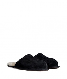 Lounge in comfort and style in these ultra-luxe shearling lined slippers from UGG Australia - Suede upper, shearling lining, slip-on style - Pair with flannel pajamas and a cozy robe