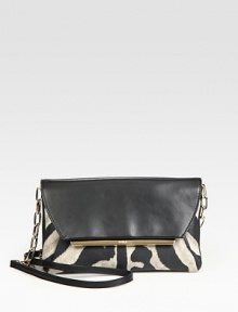 Luxurious solid and zebra-print leather with radiant hardware and a versatile detachable strap.Adjustable chain and leather shoulder strap, 19½-22 dropSnap flap closureTwo inner compartmentsOne inside zip pocketFully lined9W X 5½H X 1½DMade in Italy Luxurious solid and zebra-print leather with radiant hardware and a versatile detachable strap.Adjustable chain and leather shoulder strap, 19½-22 dropSnap flap closureTwo inner compartmentsOne inside zip pocketFully lined9W X 5½H X 1½DMade in Italy