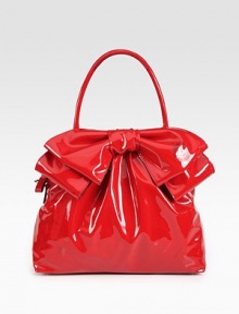 Lustrous patent leather in a roomy carryall, topped with a chic oversized bow.Double top handles, 5¼ dropRemovable shoulder strap, 15 dropTop zip closureProtective metal feetOne inside zip pocketTwo inside open pocketsCotton lining12¾W X 9½H X 4½DMade in Italy Lustrous patent leather in a roomy carryall, topped with a chic oversized bow.Double top handles, 5¼ dropRemovable shoulder strap, 15 dropTop zip closureProtective metal feetOne inside zip pocketTwo inside open pocketsCotton lining12¾W X 9½H X 4½DMade in Italy