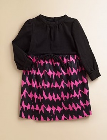 Elegant Italian ponte knit bodice tops lustrous cotton sateen skirt in a vibrant zigzag print.Band collar Bow detail at waist Long sleeves with button cuffs Back zipper 97% cotton/3% spandex Dry clean Made in USA of imported fabric