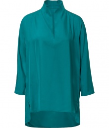 Elegant top in fine, turquoise acetate and silk blend - Luxe, lightweight fabric drapes like a dream - Chic tunic cut with small stand up collar, key hole neckline and on-trend, 3/4 sleeves - Slits at sides, hem hangs slightly lower in the back - Longer, relaxed silhouette - Easy and polished, seamlessly transitions form work to weekend - pair with cigarette pants, skinny denim, dressy shorts and pencil skirts Elegant top in fine, turquoise acetate and silk blend - Luxe, lightweight fabric drapes like a dream - Chic tunic cut with small stand up collar, key hole neckline and on-trend, 3/4 sleeves - Slits at sides, hem hangs slightly lower in the back - Longer, relaxed silhouette - Easy and polished, seamlessly transitions form work to weekend - pair with cigarette pants, skinny denim, dressy shorts and pencil skirts